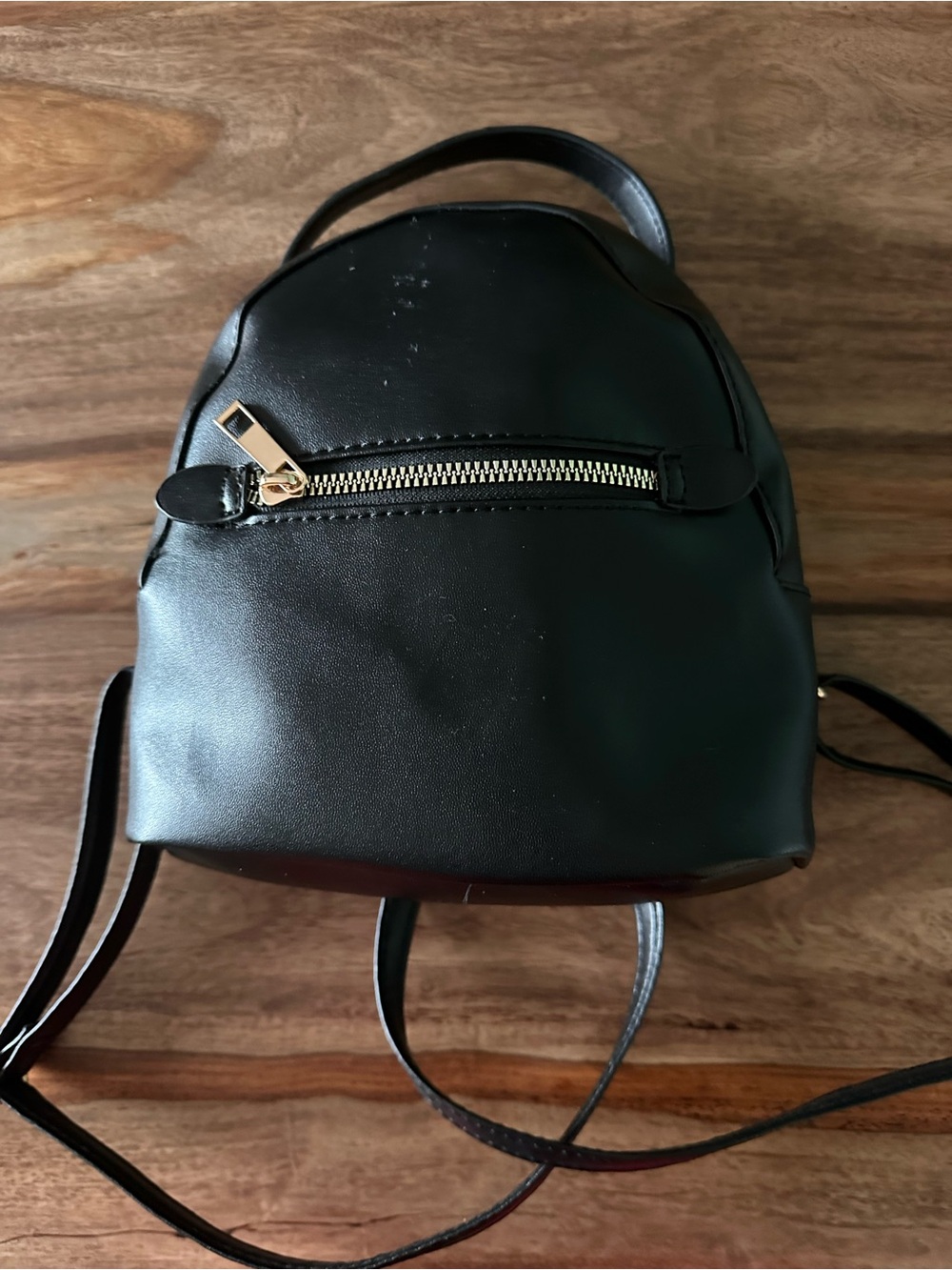 Tiny black backpack purse 7” by 7.5” by 3.5” side gold zip pocket faux leather